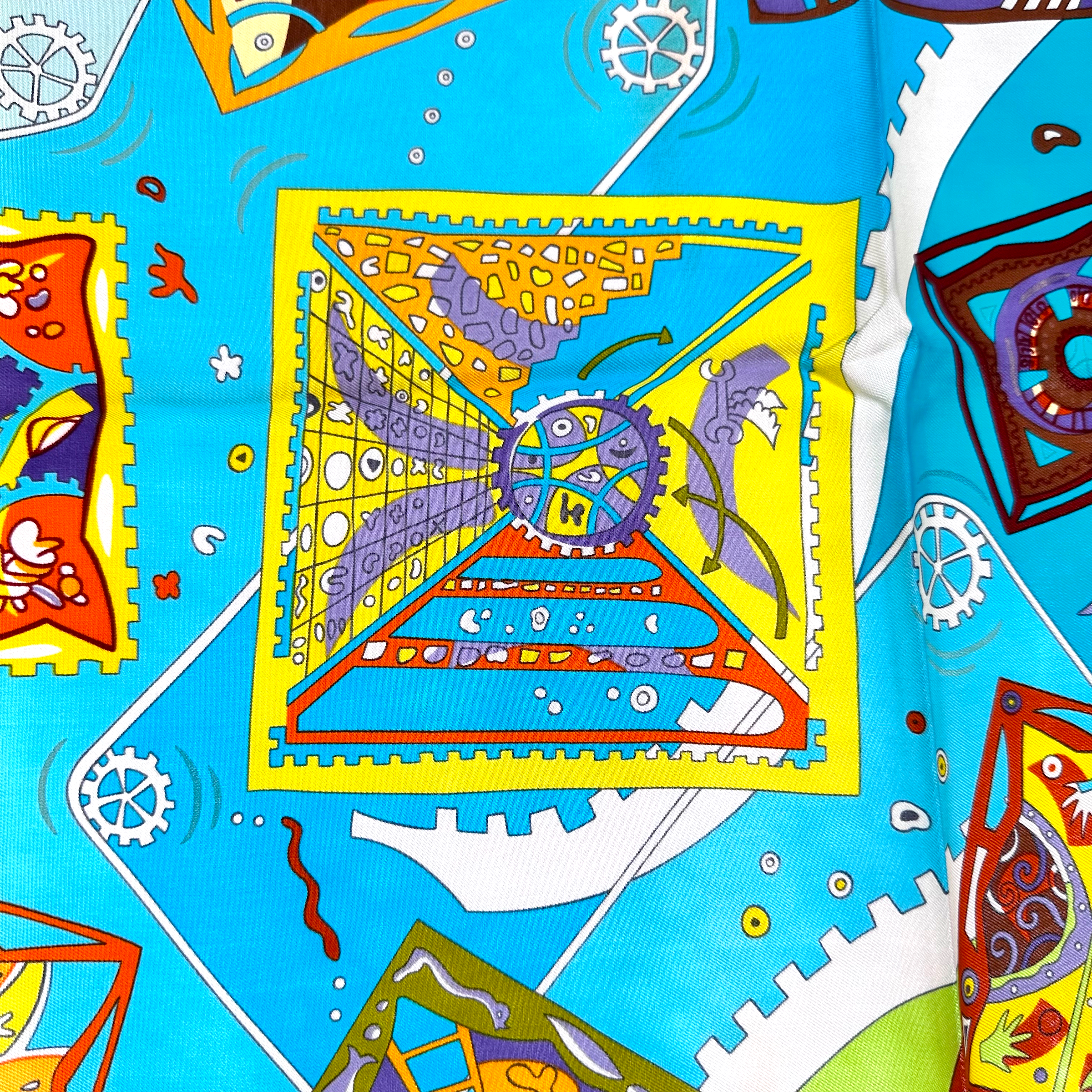 zoom sur détail rouage multicolore symbolisant la naissance d'une idée