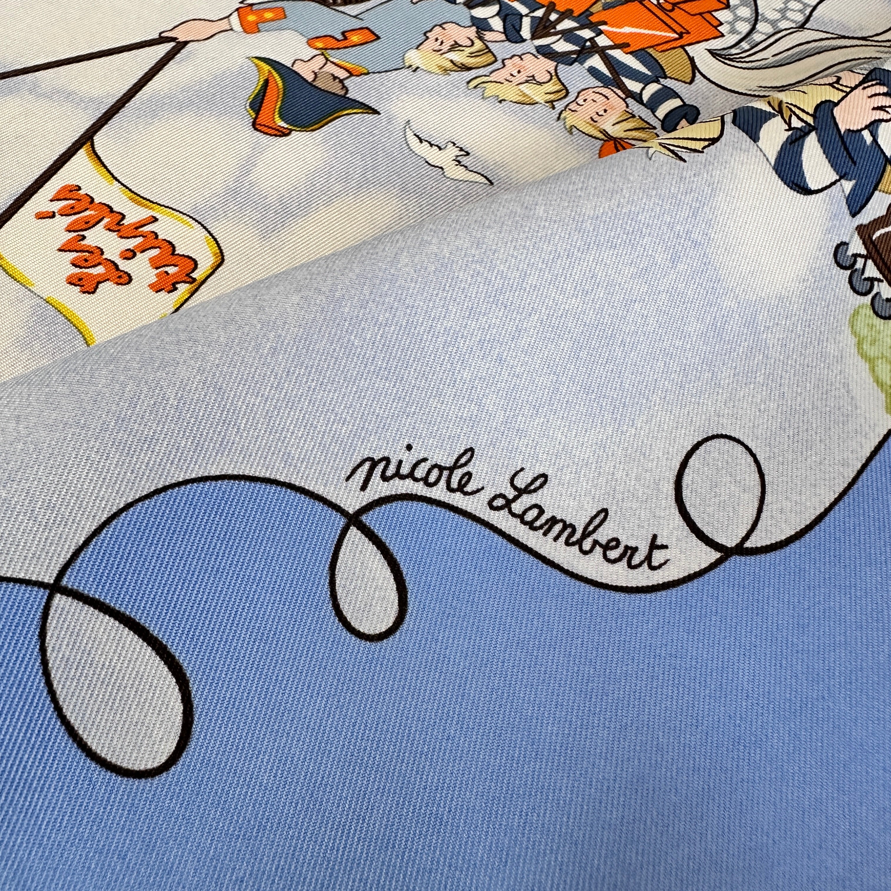 Signature de l'artiste Nicole Lambert sur fond de ciel nuageux.